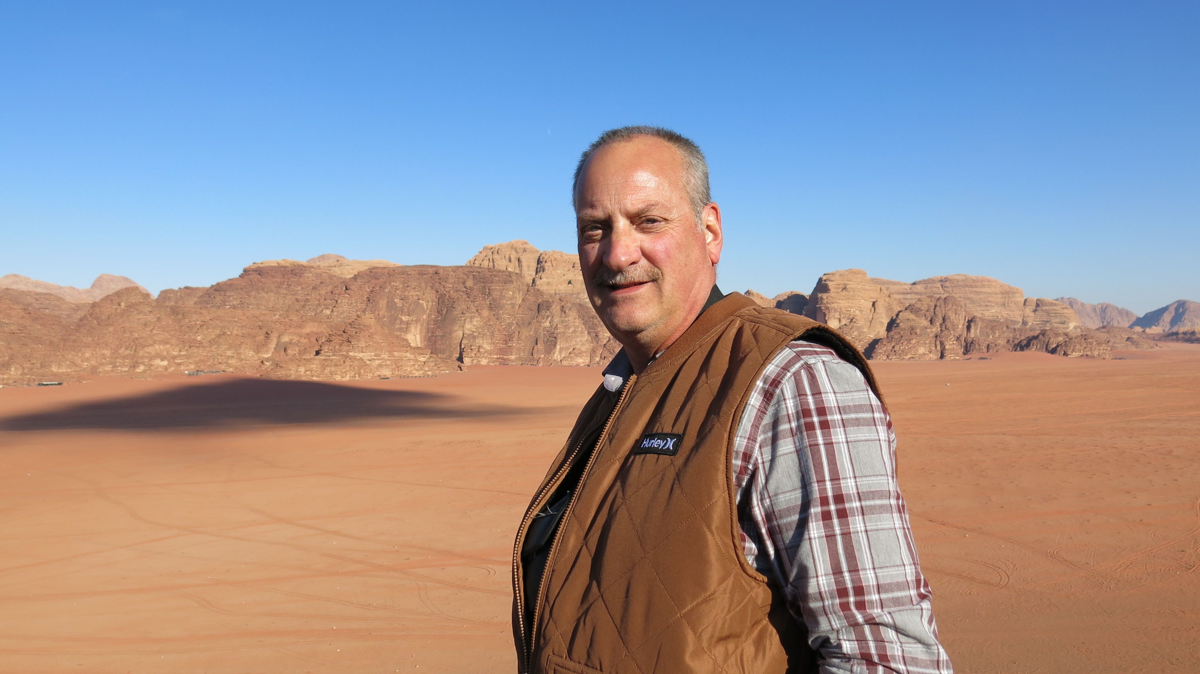 Thomas Foulke stands in the desert 