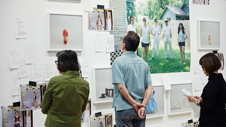 Image of people looking at photography.