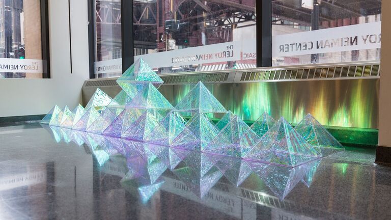 Student work featuring translucent pyramids