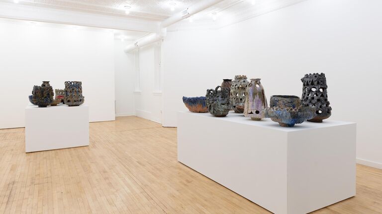 Ceramic vessels on gallery tables