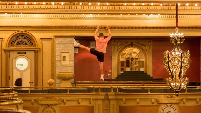 A photo of a visiting artist dancing