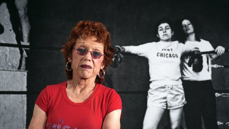 Judy Chicago beside boxing Judy Chicago