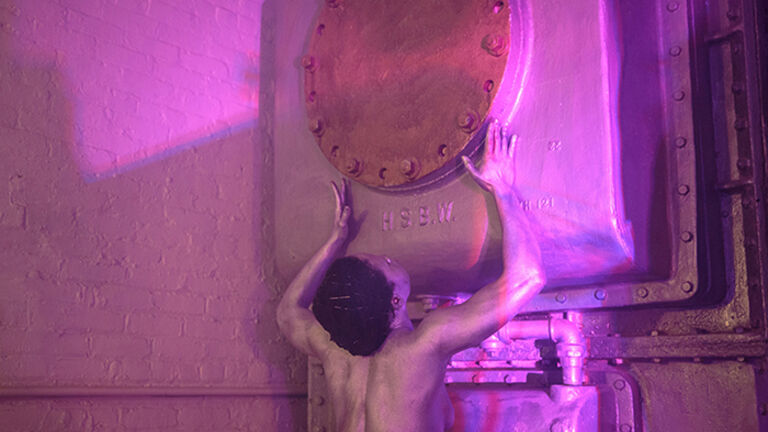 Tara Jo Tashna, one of the performers in the shower. Photo: Walter Wlodarczyk via MoMA PS1