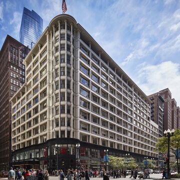 A large V-shaped building on a corner in Chicago.