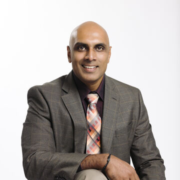 A headshot of Devarajulu Ravichandran, Vice President of Educational Technologies and Chief Information Officer