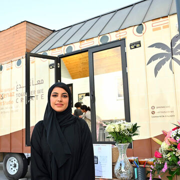 Ghaleya Almansoori stands in front of her Kenaz caravan