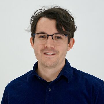 Headshot of a person against a white background