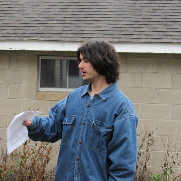 A headshot of SAIC writing center tutor Ezekiel Cambey 