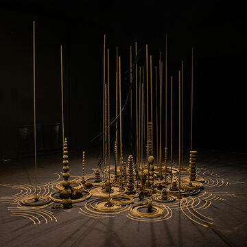 Sculpture of stacked rings, spheres, and poles by Kyriakos Alexander Paraskevopoulo