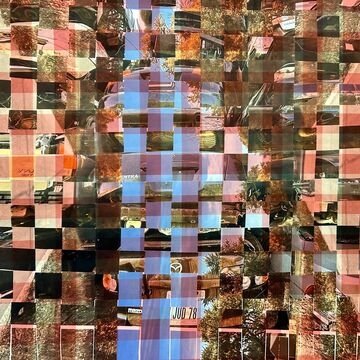 Photo of red gingham fabric with photos woven into the print. The photos depict a junkyard car tower and two mirrored landscapes from a car driver perspective.