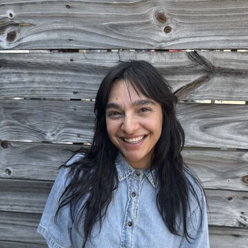 Portrait of an adult woman standing outdoors