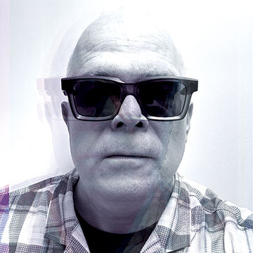 A black and white photo of SAIC faculty member Mark Booth