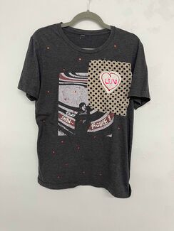 A black Elliott Smith Figure 8 shirt with rhinestones and a polka-dotted patch sewn on. 