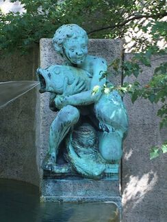 The Fountain of the Great Lakes with a sculpture of a boy holding a dolphin