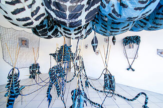 Multimedia fiber installations by Jade Yumang  in a gallery space. 