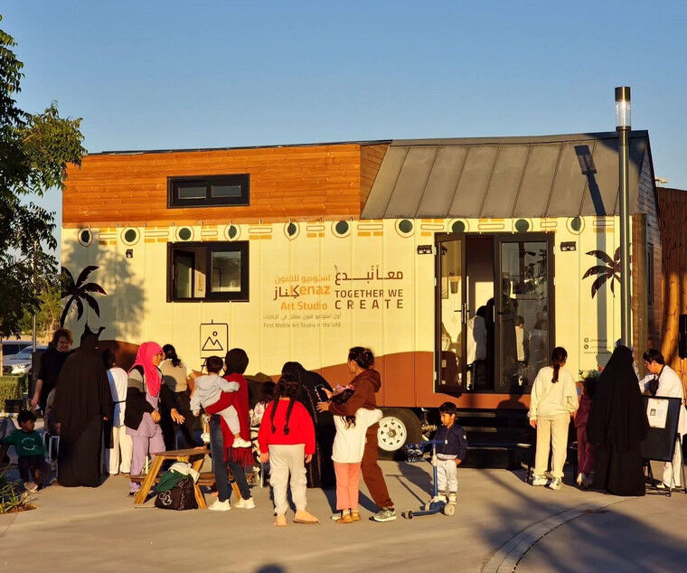 A crowd gathered around Kenaz art center outside during late afternoon.