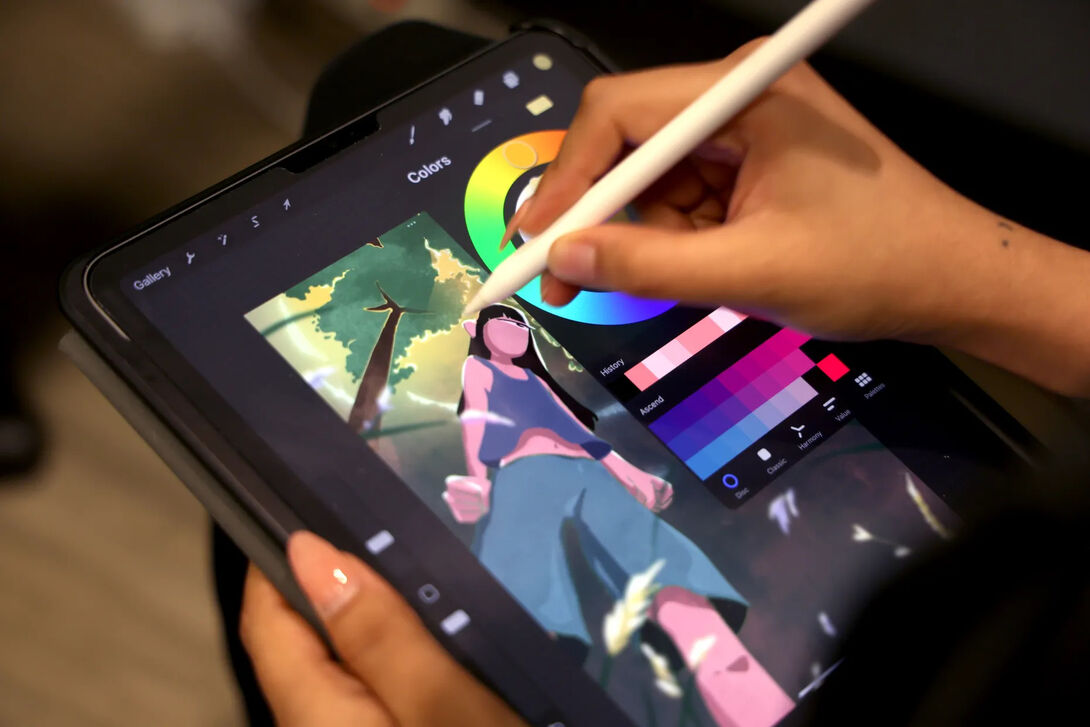 Nitya Mehrotra, 23, an artist programming assistant at Urban Gateways, sketches on her iPad on June 25, 2024, in Chicago.