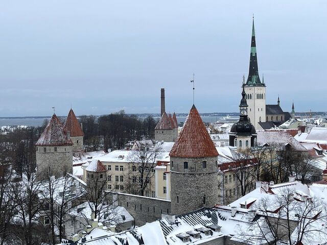 Part of Tallinn’s medieval wall, St. Olaf’s church steeple, and the sea