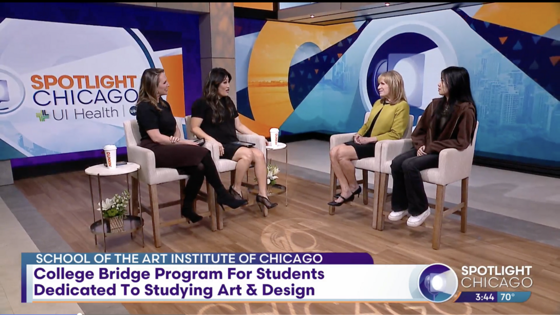 Four women sit in chairs on the set of a daytime talk show