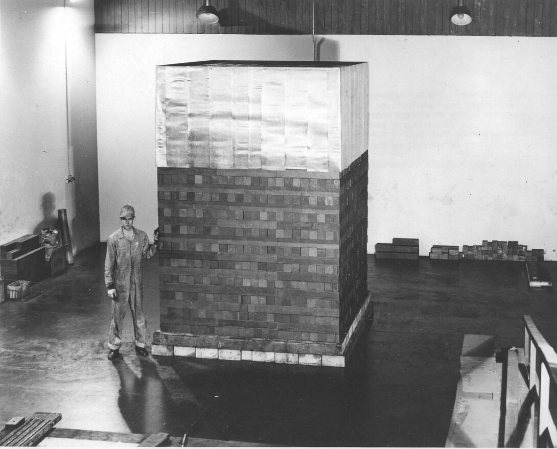 Black and white photo of a man standing in the Met Lab at Argonne National Laboratory